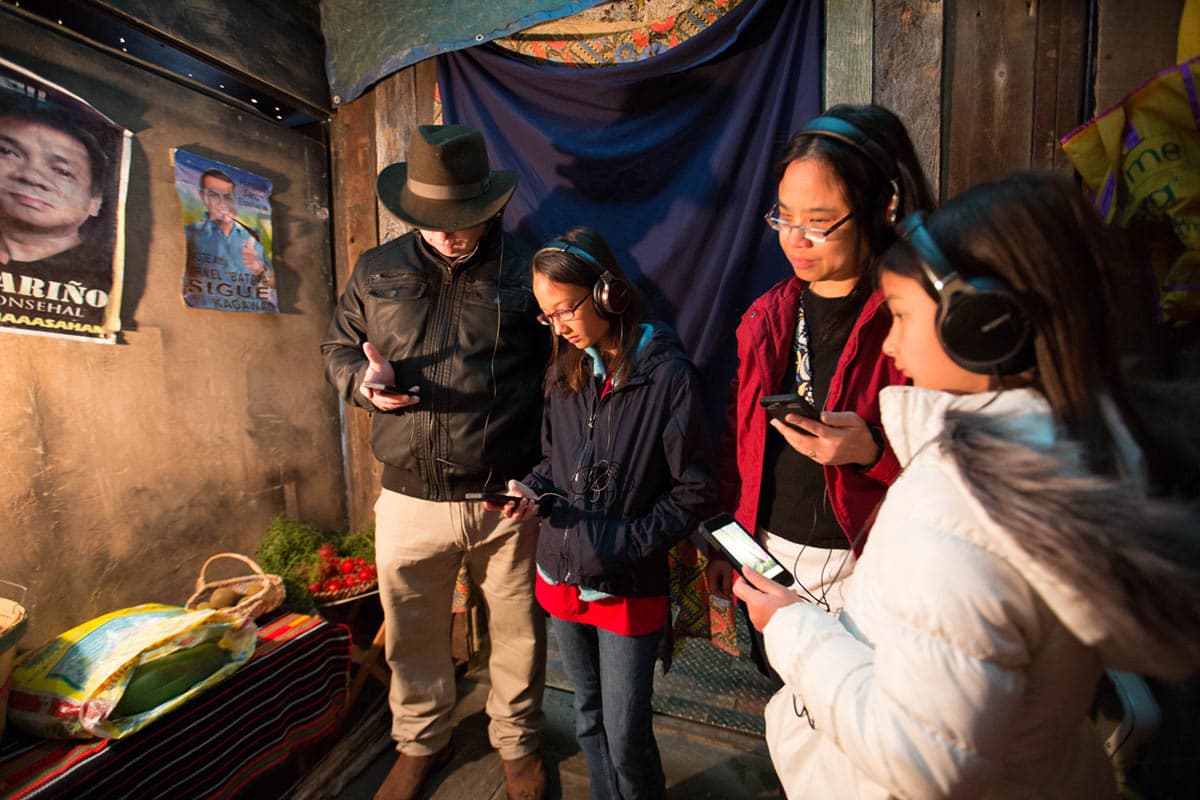 A mom helps her children with the tour